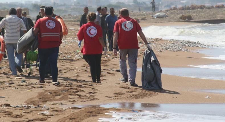 the red cross is working on removing the bodies from the sees 