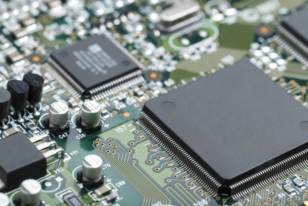 Closeup of electronic circuit board with CPU microchip electronic components background