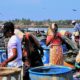 Sri Lankan fishermen working on the river bank.