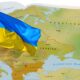 Ukraine flag over the map of world.