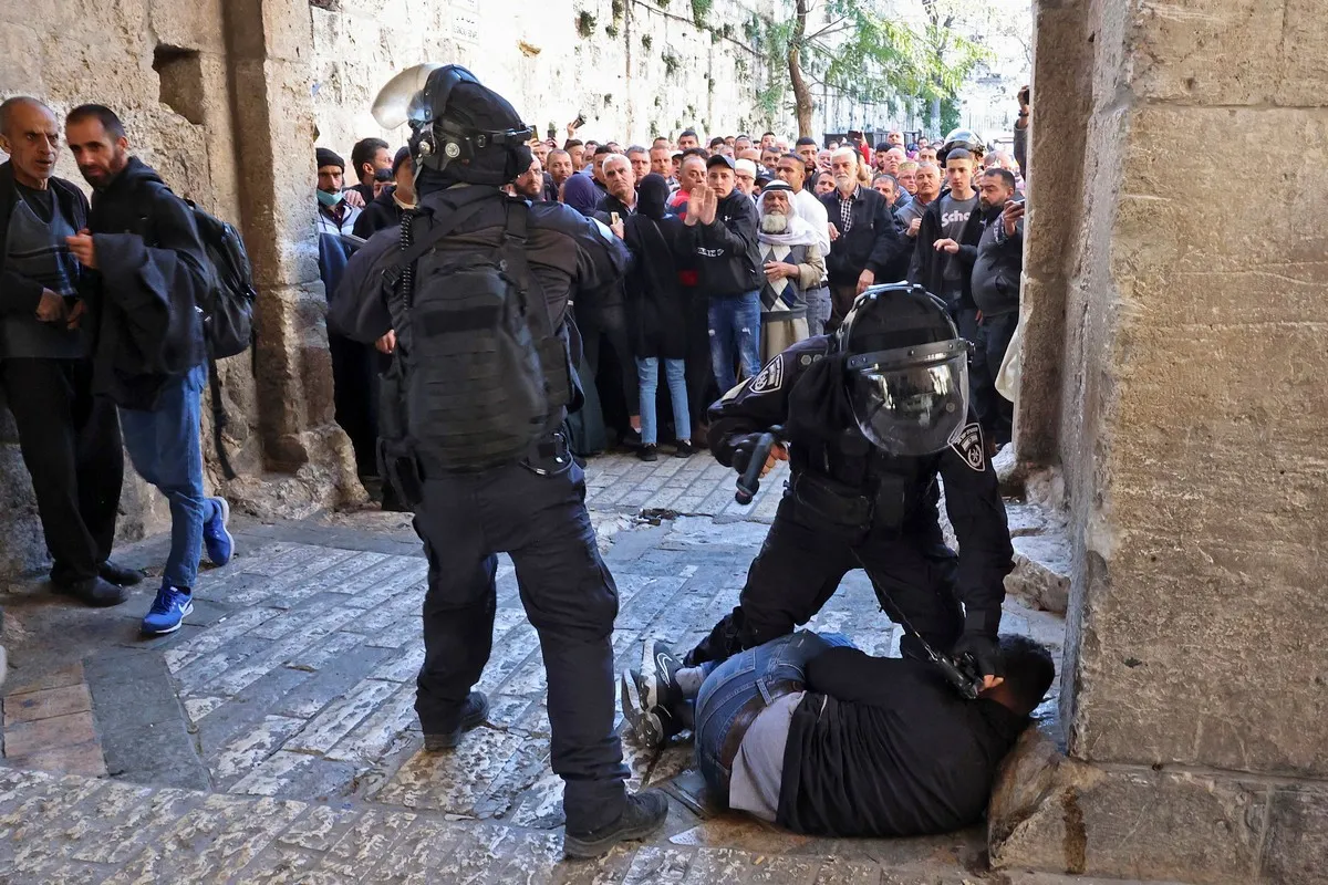 Israeli forces arresting a Palestinian