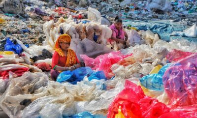 Women separating plastic trash.