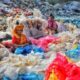 Women separating plastic trash.