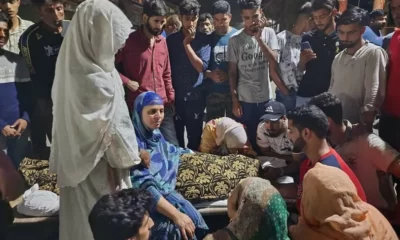 Family of 21-year-old Muslim staging a demonstration outside their residence in Srinagar