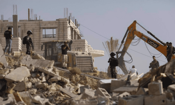 Israeli forces demolish a Palestinian house in Jerusalem